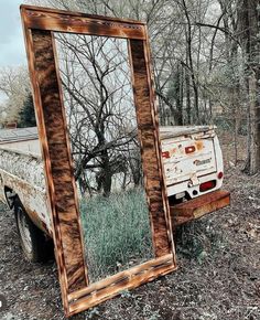 an old truck with a mirror on the back