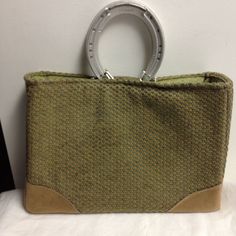 This is a handmade handbag/purse from Stablebags.  Durable wool blend fabric outside (mostly a moss green with a little red and yellow) with a tan suede-type fabric at the bottom corners and bottom.  Inside lining is a moss green cotton with a pocket for a cell phone.  It has a magnetic closure.  It has reinforced sides and bottom.  It has been treated with Scotch Guard fabric protector.  The handles are genuine aluminum racing plates (horse shoes).  The original purchase of this item benefited Green Bags For Daily Use In Fall, Green Rectangular Shoulder Bag For Fall, Green Canvas Satchel With Double Handle, Vintage Green Satchel For Shopping, Green Satchel Bag With Rolled Handles, Green Fall Satchel For Everyday Use, Green Gothic Satchel For Everyday Use In Fall, Everyday Green Satchel For Fall, Everyday Green Fall Satchel