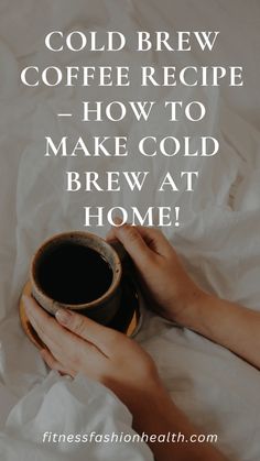 a person holding a cup of coffee on top of a white sheet with the words cold brew