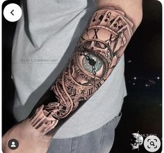 a man's arm with an eye and clock on it