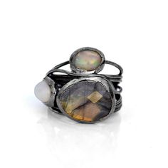 GemFormingStudio D E T A I L S Labradorite Ring | Fire Opal Ring | Wire Wrapped Ring | Gemstone Ring | Ring For Her, Ring For Women, Statement Ring, Stackable Ring, Unique Ring Size : All sizes Available Weight : 5.62 gm Stone Size : 16 x 13 mm Material : Brass Polish : Gold Polish . Contact us for wholesale prices. R I N G S https://www.etsy.com/in-en/shop/GemFormingStudio?section_id=22783374 B E A D S https://www.etsy.com/in-en/shop/GemFormingStudio?section_id=22828835 W A N D S https://www.et Fusion Style Stackable Round Rings, Adjustable Hand Forged Fusion Rings, Fusion Rings With Oval Natural Stones, Open Opal Ring With Natural Stones For Anniversary, Fusion Oval Rings With Natural Stones, Fusion Style Oval Rings With Natural Stones, Fusion Style Oval Ring With Natural Stones, Hand Forged Round Rings For Jewelry Making, Fusion Rings With Natural Stones For Anniversary