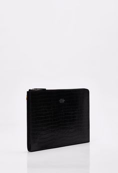 Carry your business essentials in style with our Monaco Croco Large Folio. Smart and compact, with space to hold a 15” laptop, an iPad, notebooks & papers. Handcrafted in our Crocodile Embossed leather, this rigid structure large folio was made to last a lifetime. Designed with wide zip-around opening for easy access, this pouch is sure to become a workwear staple. Dimensions- Height 10.6" - Length 14.2" - Width 1.2" Modern Leather Organizers, Rectangular, Modern Leather Organizer, Rectangular Shape, Modern Rectangular Leather Organizers, Modern Rectangular Office Organizers, Rectangular Workwear Cases With Laptop Sleeve, Modern Laptop Bag With Sleeve For Business, Modern Formal Laptop Sleeve Case, Modern Laptop Bag With Sleeve For Business Meetings, Elegant Formal Laptop Sleeve Case