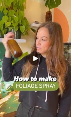 a woman is holding a bottle in her hand and looking at it with the words how to make folige spray