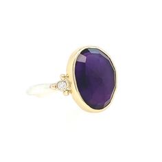 One of the most vibrant Amethysts we have come across, this rosecut gem is set in 14k yellow gold with gold accent beads, petite diamonds, and a sterling silver freeform band. Approx stone size: 15mm x 12mm Approx ct weight: 5.25cts Mohs hardness: 8 This one of a kind piece is handmade with love in Emily's Hudson Valley studio. If you have questions about sizing, shipping or need help deciding please reach out to us! Elegant Faceted Birthstone Ring In 14k Gold, Yellow Gold Amethyst Gemstone With Accent Stones, Fine Jewelry Amethyst With Bezel Setting, Amethyst Gemstones With Accent Stones, Purple 14k Gold Ring With Rose Cut Diamonds, Purple Rose Cut Diamond Rings In 14k Gold, Purple 14k Gold Rings With Rose Cut Diamonds, Amethyst Diamond Ring With Gemstone Accents, Amethyst Diamond Ring In Yellow Gold