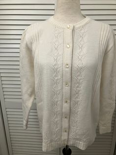 "Vintage white acrylic cardigan pearlized buttons unique cutwork pattern sweet go w/ everything cardigan sweater Made in USA like new vintage. Machine washable and dry. Highpoint Sprtwear  label  Shoulder 16\" Chest 22\" pit to pit (44\" buttoned) Sleeve 22 1/4\" ( 26 3/4\") Length 24 1/2\" from bottom of neck to bottom of hem Bottom 44\" 8 buttons" Elegant Cream Button-up Sweater, Elegant Cream Sweater With Buttons, Elegant White Cable Knit Cardigan, White Daywear Sweater With Button Closure, Classic White Cardigan With Buttons, Classic White Sweater With Buttons, White Pointelle Knit Cardigan For Daywear, White Button-up Cable Knit Cardigan, Classic Cream Cardigan With Pointelle Knit