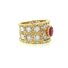 This spectacular ruby and diamond band has all the hallmarks of a timeless piece of heirloom jewelry. Made in Italy of 18k yellow and white gold, this ring features a fine-quality Burmese ruby weighing 1.68 carats, set in a beautifully detailed 18k yellow gold bezel. The ruby has intense color and exceptional brilliance, which is highlighted by the intricate, masterful gold craftsmanship and the striking combination of brilliantly engraved white and yellow gold. This ring has a wide band and can Luxury Red Diamond Ring With Single Cut Diamonds, Luxury Ruby And Diamond Ring In Yellow Gold, Luxury Ruby Ring With Diamond In Yellow Gold, Classic Yellow Gold Ruby Ring With Single Cut Diamonds, Luxury Diamond Ring With Lab-created Ruby Accents, Red Diamond Ring With Single Cut Diamonds, Luxury Yellow Gold Ruby Ring With Diamond Accents, Luxury Yellow Gold Ruby Ring With Single Cut Diamonds, Luxury Ruby Ring With Diamond Accents In Yellow Gold