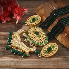 This is a stunning handmade necklace perfect for high end Jewelry Collector, a keeper in Traditional Vintage Indian/Pakistani Bridal jewelry and a Luxury Gift for your Daughter, Sister or Wife on Wedding or Anniversary. Perfect for any type of occasions, weddings And celebrations and a beautiful & memorable gift for weddings and special occasions. -Item Code:- L624 -Bottle Green Gemstone Beaded Necklace Set with Earrings. -Designer multi layered faceted Bottle Green Gemstone beaded necklace. -Gold Plated Set with Kundan Stones which shine like Polki Diamonds. -Metal: Gold plated brass -Earrings are 55mm long & 28mm wide approx -Push Back Earrings -Necklace length with pendant 12" approx excluding adjustable dori/cord -Quantity:- One Necklace Set Please see more different designs here:- htt Luxury Meenakari Gold Plated Necklaces, Luxury Meenakari Pearl Necklace For Celebration, Luxury Bridal Meenakari Pendant Necklace, Luxury Brass Jewelry With Meenakari, Luxury Meenakari Necklaces For Gift, Pakistani Bridal Jewelry, Necklace Set With Earrings, Gemstone Beaded Necklace, Vintage Indian