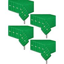 four green plastic football field dividers