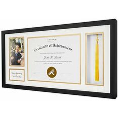 a framed diploma with a tassel hanging from it's center and an award plaque in the middle