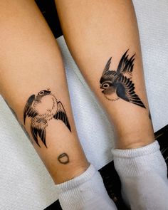 two tattoos on both legs with birds flying above them