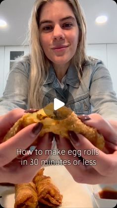 a woman is holding some food in front of her face and the words how to make egg rolls in 30 minutes or less