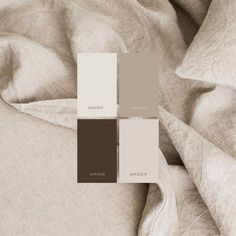 an image of a bed with sheets and pillows on it's side in sepia tones