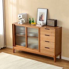 Constructed from high-quality oak, this cabinet exhibits both beauty and durability. The design includes a sizable cabinet and four parallel drawers, offering generous storage space for your dining essentials. But the star of the show is certainly the glass sliding door design. Not only does it exude elegance, but it also efficaciously saves operational space in your dining area. This blend of functionality and aesthetics makes this hutch an ideal choice for any home. Hokku Designs | Hokku Desig Glass Sliding Door Design, Glass Sliding Door, Sliding Door Design, Walnut Sideboard, Side Cabinet, Sideboard Cabinet, Wall Cabinet, Sliding Glass Door, Sliding Door