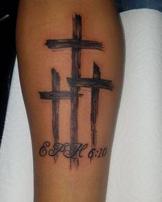 a cross tattoo with the word faith on it