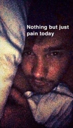 a man laying in bed with the caption'nothing but just pain today '