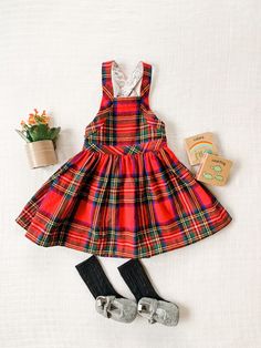 Mae Bib Dress // Plaid Overall Dress // Baby&Toddler Dress // Tartan Plaid Dress This adorable handmade bib/overall dress is made with a multi color tartan plaid, brushed 100% cotton. The back has three buttons and is easy to get on and off. To make sure you have the best fit, please check the weight and height of your child and compare to the sizes chart. We would recommend sizing up if between sizes.  The color may vary slightly due to differences in viewing devices. Fabric is pre-washed prior Fitted Cotton Dress With Bib Front, Plaid Sleeveless Dress For Playtime, Sleeveless Plaid Dress For Playtime, Plaid Bib Dress, Cute Sleeveless Pinafore Dress For Playtime, Toddler Plaid Dress With Boots, Plaid Cotton Dress For Playtime, Plaid Overall Dress, Green Plaid Toddler Dress