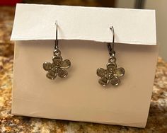 Silver flower earrings, dangly, clasp fully closes so they won't fall out Silver Flower Earrings, Doll Jewelry, Silver Flowers, Flower Earrings, Cincinnati, Doll Toys, Etsy Earrings, Doll Clothes, Action Figures