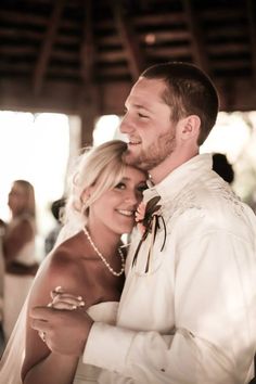 a bride and groom are smiling for the camera