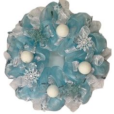 a wreath with snowflakes and balls on it