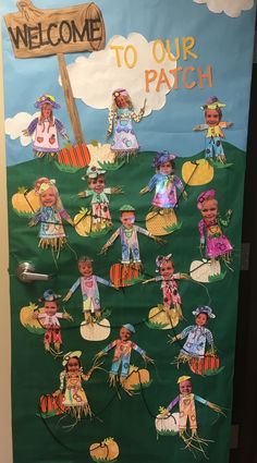 a bulletin board is decorated with children's costumes and welcome to our patch sign