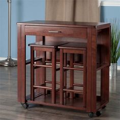 a wooden table with two stools on wheels and one drawer open to the side