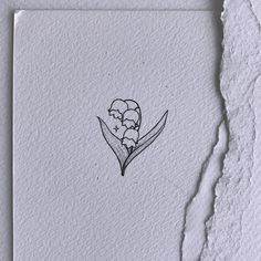 a piece of paper with a drawing of a flower on it's side and the word