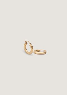 Your favorite oversized hoops. Wear them day to night, with jeans and a white tee or a power pant suit. We made them easy to put on (trust us, we've tried on every hoop!) and hollow, so they won't weigh you down.Complete the look with our Pavé Hoop Huggie Earrings. Hinged back closure. 14k solid gold—always Weight: 0.5g per earring Measurements: 3x15mm Classic Gold-tone Hoop Earrings, Minimalist Gold-tone Gold-plated Hoop Earrings, Chic Gold-tone Small Hoop Earrings, Gold-tone Small Hoop Brass Earrings, Gold-tone Hardware Small Hoop Earrings, Fall Rings, Broken Chain, Ring Sizer, Huggies Earrings