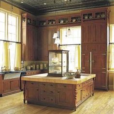 a large kitchen with wooden cabinets and an island