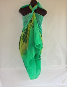 This silk sarong measures 71 by 35 inches or 180 by 90 centimetres. It is large enough to wrap around your body for the beach. You can wear it as a large scarf or shawl or turn it into a skirt. It will fold up very small so ideal for travelling. The sarong has hand rolled and hand stitched edges into which I sew my own label. It is hand washable and care instructions are included. I sprayed the sarong with peppermint green, lime green and spring green allowing the colours to merge. When dry I pa Green Summer Pool Cover-up, Summer Green Sarong For The Beach, Traditional Printed Sarong For Summer, Green Hawaiian Sarong For Summer, Green Hawaiian Sarong For Vacation, Green Summer Sarong For Beach Season, Green Wrap Cover-up For Beachwear, Green Wrap Cover-up For Summer, Green Wrap Sarong For The Beach