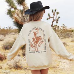 Get spooky with our Horse Girl Halloween Sweatshirt! 🎃👻 Perfect for spooky season, it's a funny and stylish cowgirl delight. Yeehaw! A pre-shrunk, classic fit sweater that's made with air-jet spun yarn for a soft feel and reduced pilling. * Gildan Unisex 18000 Crewneck Sweatshirt * 50% cotton, 50% polyester * Pre-shrunk * Classic fit * 1x1 athletic rib knit collar with spandex * Air-jet spun yarn with a soft feel and reduced pilling * Double-needle stitched collar, shoulders, armholes, cuffs, Spooky Crewneck, National Park Shirt, Spooky Style, Chapeau Cowboy, Cowgirl Shirts, Yee Haw, Cow Girl, Gildan Sweatshirts, Camping Gifts