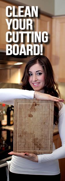 a woman holding up a cutting board with the words clean your cutting board