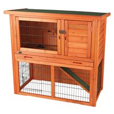 a large wooden rabbit hutch with two doors and one door open on the side