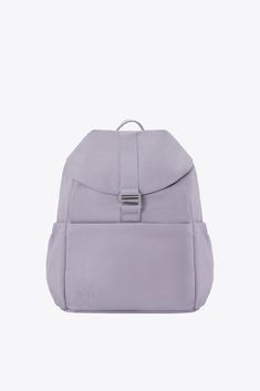 a purple backpack sitting on top of a white surface