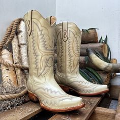 A women's western boot is a stylish and versatile footwear option that combines the classic design elements of a traditional cowboy boot with feminine touches and modern flair with a Eye-Catching Embroidery. These boots are specifically tailored to fit a woman's foot and offer a unique blend of fashion and functionality * Bone color and leather sole cowgirl boots for women with a 9 in boot shaft height and a 1.50-inch heel. * Premium leather construction sourced from Mexico, ensuring high-quality material. * Classic Western silhouette design provides a stylish and contemporary look, blending western charm with modern fashion. * Cowgirl boot that is Handcrafted by skilled artisans, offering authenticity and attention to detail in every stitch. * Designed for comfort with a cushioned insole White Boots For Western-themed Events, White Western Boots For Western-themed Events, White Snip Toe Heeled Boots For Ranch, White Country Boots For Ranch, White Country Style Boots For Ranch, Southwestern Style Snip Toe Boots For Country Events, Southwestern Snip Toe Boots For Ranch, White Country Boots With Snip Toe, White Snip Toe Country Boots