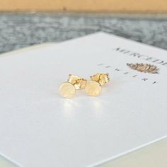 ~ 14K Gold Filled hand hammered micro minimalist stud dot earrings (solid, not plated) ~ sold by the pair ~ micro stud circle measures 4 mm x 1 mm thick ~ all earrings are final sale Caring For Your Jewelry Always remove your jewelry prior to bathing, swimming, sleeping, working out. Avoid contact with all chemicals including perfumes and lotions. Clean your jewelry with a jewelry polishing cloth. Store your clean, dry jewelry in an airtight container or jewelry baggie separate from other pieces Minimalist Hammered Earrings As Gift, Minimalist Hammered Earrings For Gift, Dainty Hammered Earrings As Gift, Hammered Minimalist Earrings As Gift, Minimalist Stud Earrings, Trendy Stud Earrings, Dot Earrings, Cloth Store, Minimalist Earrings Studs