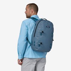 Fully submersible 29-liter backpack with minimalist construction to reduce weight without sacrificing durability. Made in a Fair Trade Certified™ factory. - Golden Caramel Pigeon Blue, Loading Icon, Mountain Biking Women, 50% Logo, Waterproof Backpack, Duffel Bag Travel, Water Repellent Fabric, Snow Jacket, Reduce Weight