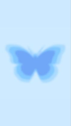 a blue butterfly flying in the sky with its shadow on it's back side