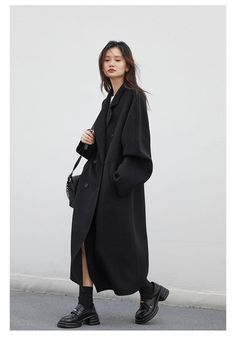 Add a touch of sophistication to your wardrobe this season with our Classic Charm Loose Fit Woolen Overcoat. Made with a blend of premium sheep wool and polyester, this coat offers both comfort and style. Featuring a casual wide-waisted design, regular sleeves, and a turn-down collar, it's perfect for any occasion. The single-breasted closure, button decoration, and solid pattern further elevate its timeless elegance. Keep warm and stylish with this must-have coat. Designed by Thekittenpark Full Length Coat Outfit, Elevate Casual Outfit, Vintage Wool Coat Outfit, Over Size Coat, Winter Coat Black, Oversize Wool Coat Women, Long Coat Style, Oversized Black Coat, Modern Oversized Wool Coat