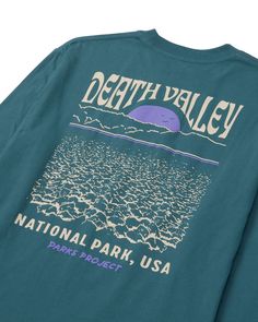 Embrace the mystique of Death Valley's landscapes and relive its iconic moments with our comfortable and stylish long-sleeve tee. A light puff print graphic is featured on both the front and back of the tee, adding a touch of style that's perfect for any adventure. National Parks Tshirt, National Park Tshirt, Long Sleeve Tshirts, Parks Project, Graphic Shirt Design, Dusty Teal, National Park Shirt, Printed Tshirt, Iconic Moments