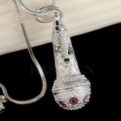 "PERFECT CHRISTMAS GIFT FOR LADIES / SINGER / VOCAL IN A BAND You are getting a 3D Microphone Pendant with Swarovski crystals. It comes with a FREE 18\" inches silver finish snake necklace with lobster clasp. The actual necklace is much more sparkling than the pictures. This is a microphone shaped pendant, but it does not work as a real microphone. Pendant size is 3/8\" wide X 1 1/4\" high (10mm X 33mm) Crystal Color: Amethyst Prices are in US$. For shipping policies and other important informat Flamingo Necklace, Crystal Purple, Face Necklace, Music Jewelry, Velvet Heart, Snake Necklace, Charm Pendant Necklace, Silver Moon, Agate Pendant