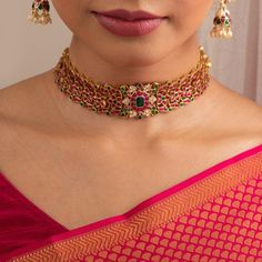 Description One of our favorites at Paksha! Contemporary aesthetics meet traditional elegance in this gold plated silver choker. Intricate floral motifs, studded with closely set semi-precious Kempu stones this versatile necklace sits perfectly pretty on the neck. Product Information Materials used : 925 Silver with 1.0-microns Gold Plating Stones: Semi precious stones Length: 20 cm and adjustable Findings: Hook and links Luxury Traditional Choker For Festive Occasions, Affordable Traditional Jewelry For Festive Occasions, Gold Plated Jewelry Indian, Symbol Of Grace, Simple Choker Necklace, Choker Sets, Mango Mala, Gold Ruby Necklace, Gold Jewelry Prom