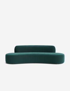 two green couches sitting next to each other