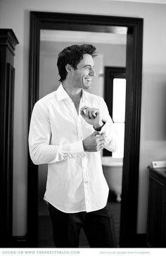 black and white photograph of a man brushing his teeth