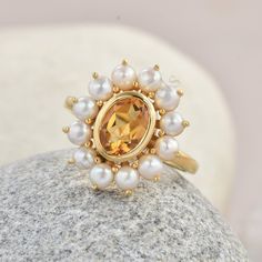 Natural Madeira Citrine Pearl ring > Natural gem stone gift Ring wedding gift ring  > Metal Type:  Sterling Silver > Metal Steam : 925 >  GEM STONE TYPE . Madeira Citrine  . oval  6x8 . 1 pcs  .Cubic Zirconia :  marquise /2.5x5 -4 pcs  . Cubic Zirconia: round 2 mm 6 pcs >Plating  Availability:-  White Rhodium plating/Yellow Gold Plating/Rose Gold Plating. >Product Category:-- Wedding Ring, Engagement Ring, Promise Ring, Anniversary Gift FEATURE >Purity Stamp *Safe  Shipping  of Your Jeweler Orde Citrine And Pearl Ring, Fine Jewelry Citrine Crystal Ring For Anniversary, Citrine Anniversary Ring With Center Stone, Anniversary Citrine Ring With Center Stone, Anniversary Citrine Open Ring, Wedding Jewelry With Citrine Center Stone, Citrine Center Stone Wedding Jewelry, Wedding Jewelry With Citrine Birthstone, Classic Topaz Birthstone Ring For Gift