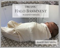 a baby wrapped in a white blanket laying on top of a bed with the words organic halo bassinet