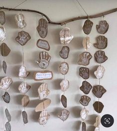 a group of handprints hanging on a wall