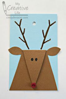 an origami deer with antlers on it's head is shown in front of a blue background