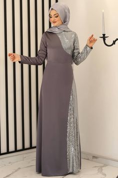 Made of lycra satin fabric.  Sequin fabric is used.  The weight of the dress is 680 grams.  It is a lined dress.  The length of the dress is 150 cm.  Measurements for size 38 92 cm bust, 72 cm waist, 100 cm waist Elegant Long Gray Dress, Maxi Length Dress With Modesty Panel, Gray Maxi Party Dress, Gray Maxi Length Party Dress, Eid Sequin Maxi Length Dresses, Eid Evening Tunic Dress, Modest Floor-length Dresses For Eid, Modest Long Dresses For Eid, Fitted Tunic Dress For Party