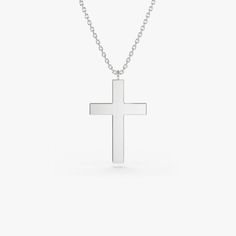 Gold KT: 14K Custom Gold Color: Rose Gold, Yellow Gold, White Gold Cross: 18 x 11 MM This 14k plain gold dangling cross necklace is a simple yet stunning accessory that will add a touch of sophistication to any outfit. The delicate gold chain holds a beautifully crafted cross charm that dances elegantly with every movement. Measuring approximately 18mm in size, this necklace is the perfect size for everyday wear, and the 14k gold construction ensures that it will last for years to come. Classic Sterling Silver Cross Necklace For Formal Occasions, Elegant Sterling Silver Crucifix Necklace, Classic White Gold Crucifix Necklace, Classic Polished Crucifix Cross Necklace, Classic White Gold Cross Necklace, Classic Sterling Silver Pendant Cross Necklace, Classic Sterling Silver Crucifix Necklace, Classic Crucifix Cross Necklace For Formal Occasions, Classic White Gold Cross Necklace In Sterling Silver