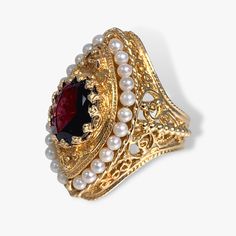 14k Yellow Gold Oval Garnet and Pearl Vintage Cocktail Ring | Sheena Stone Most Expensive Jewelry, Garnet And Pearl, Vintage Setting, Colombian Emerald Ring, Vintage Engagement Rings Sapphire, Pearl Vintage, Vintage Cocktail Ring, Edwardian Jewelry, Tanzanite Stone